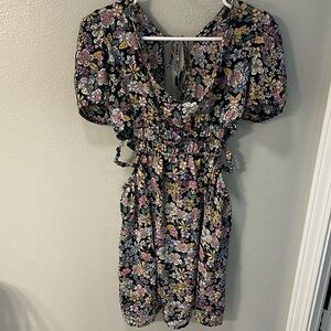 Floral dress. Size large. Waist has cutouts. Brand new without tags